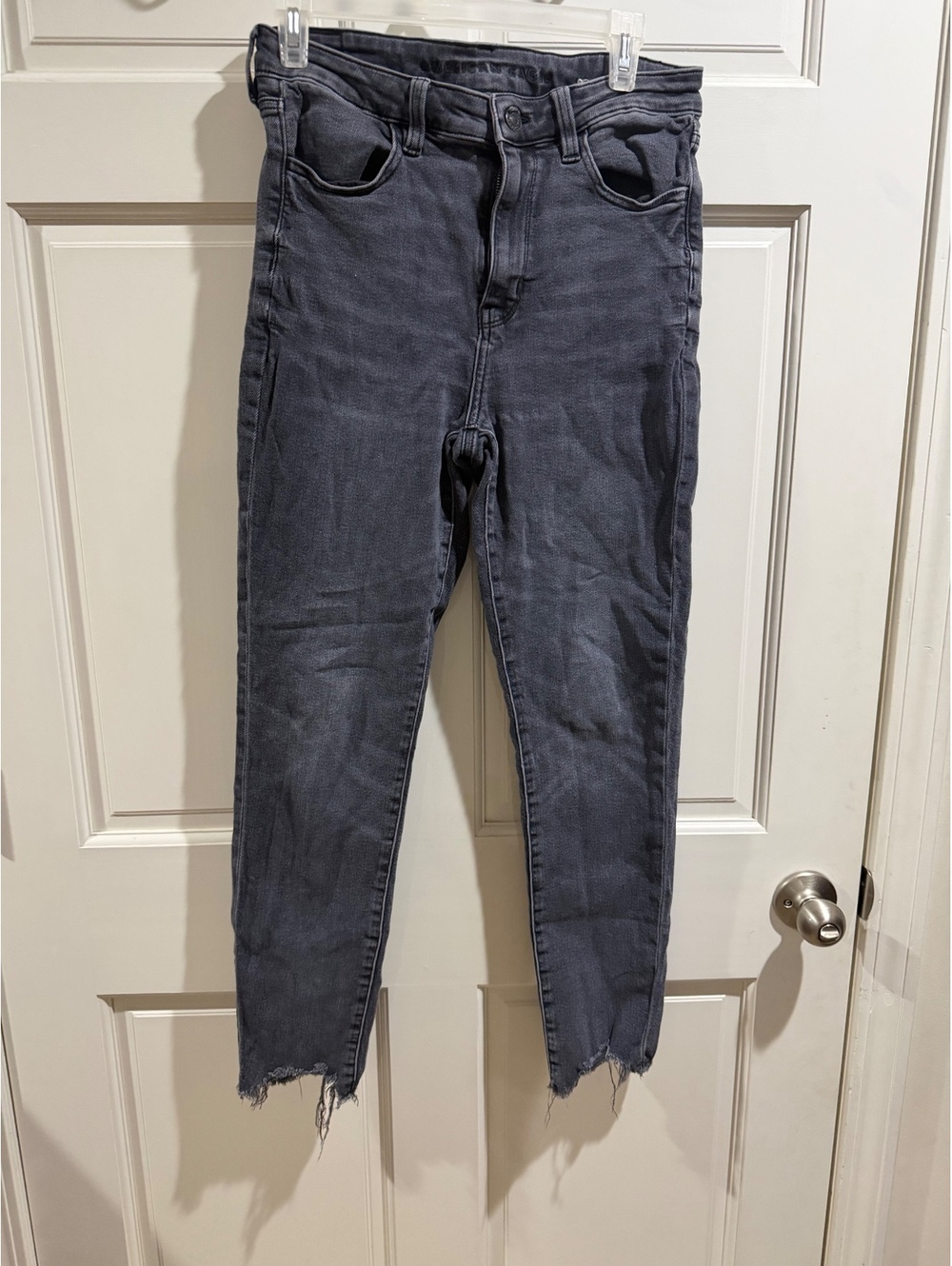 American Eagle Super Stretch Black Jeans with Raw Hem size 10